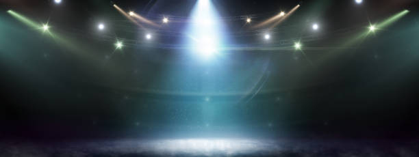 istock Hockey rink background. Searchlights. Stage for presentation illuminated by spotlights. Lights abstract background 1285373371