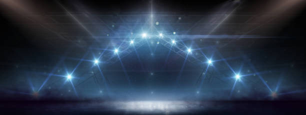 istock Empty ice rink illuminated by spotlights. Lights abstract. Winter scene Illumination. Light Effect. Sport 1285373380