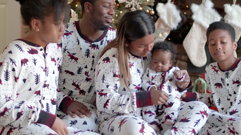 A cute family wear matching Christmas pyjamas