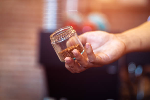 istock Barista show coffee beans in drip glass. 1285379415