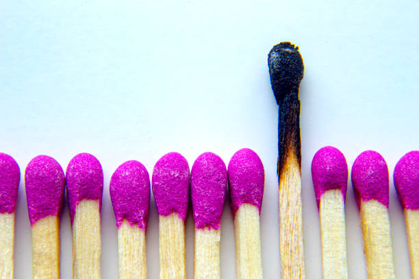 istock Pink unlit matches and a burned match on a white background. Concept: emotional burnout, mental health. 1285380184