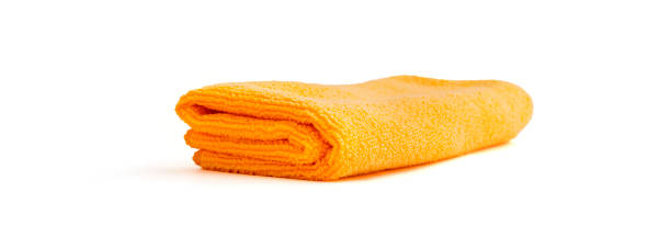 toalla de tela de color aislada sobre fondo blanco - towel indoors single object simplicity fotografías e imágenes de stock