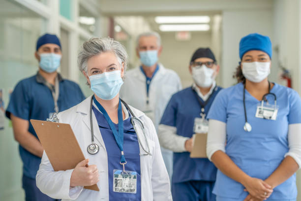 istock Group of Masked Doctors 1285381228