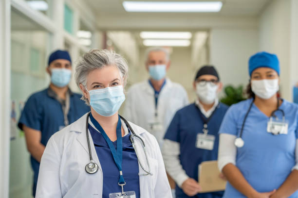 istock Group of Masked Doctors 1285381245