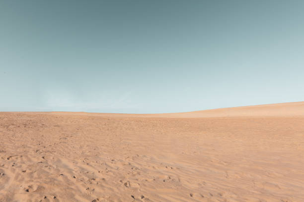 istock Sand dunes with blue skies 1285384138
