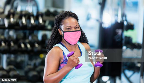 Africanamerican Woman At The Gym Wearing Face Mask Stock Photo - Download Image Now