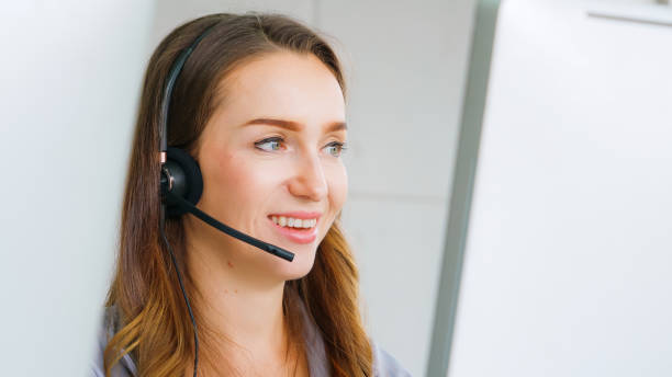 istock Business people wearing headset working in office 1285394462
