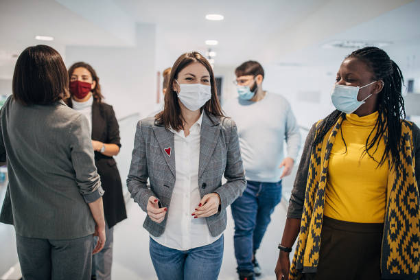 istock Group of people in modern firm building corridor 1285395705