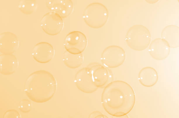 istock Beautiful shiny transparent yellow soap bubbles floating in the air. Abstract, Celebration, Natual fresh summer, Chrimas holiday soft blue texture. 1285395859