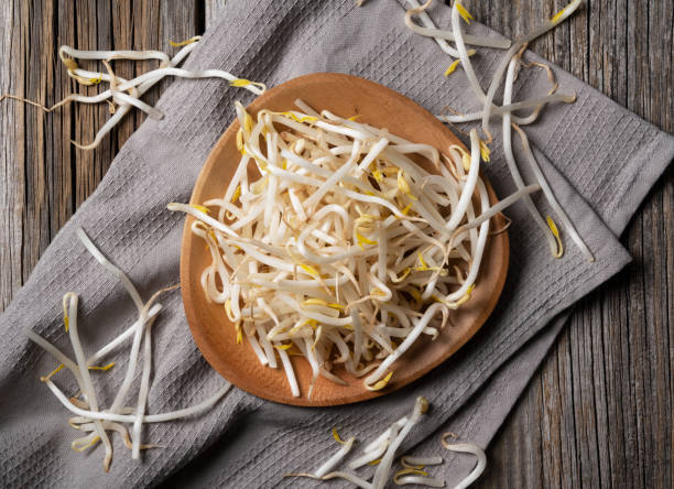 istock Bean sprouts in a wooden plate placed against the background 1285397455