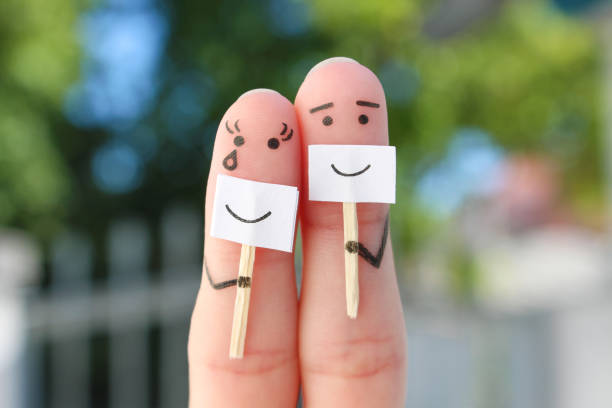 Fingers art of couple. Concept of people hiding emotions. Fingers art of couple. Concept of people hiding emotions. cheesy grin stock pictures, royalty-free photos & images