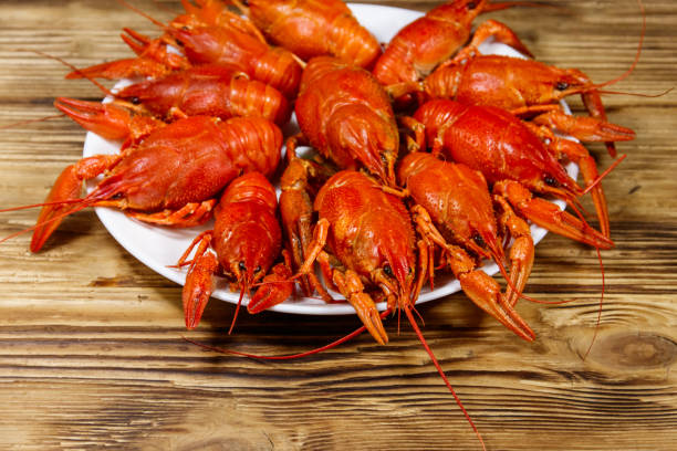 istock Boiled crayfish in plate on wooden table 1285400366