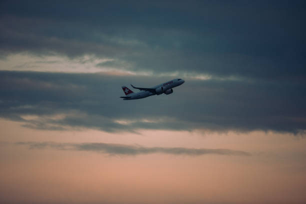 Zurich, Switzerland - November 12,2020: A Swiss International Air Lines A320NEO departing after sunset.