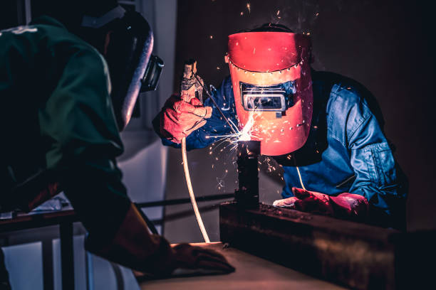 istock Metal welding steel works using electric arc welding machine 1285406087