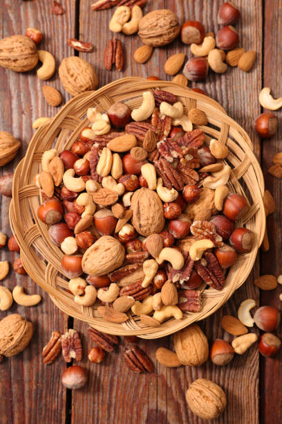 istock assorted of nuts- walnut, almond, pecan and cashew 1285406090