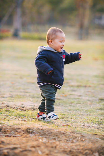 istock Cute little boy playing on the law 1285409689