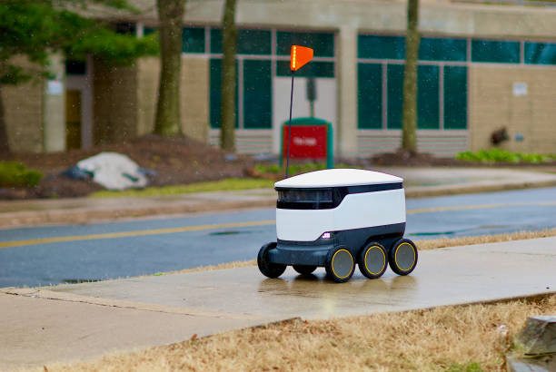 single food delivery robot in the snow, george mason university - george mason imagens e fotografias de stock