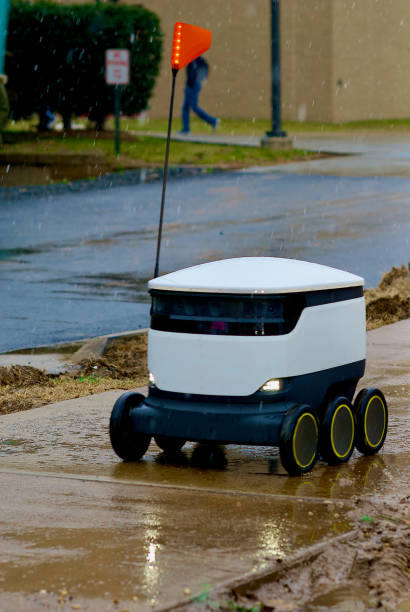 close-up, food delivery robot in the snow, george mason university - george mason stock-fotos und bilder