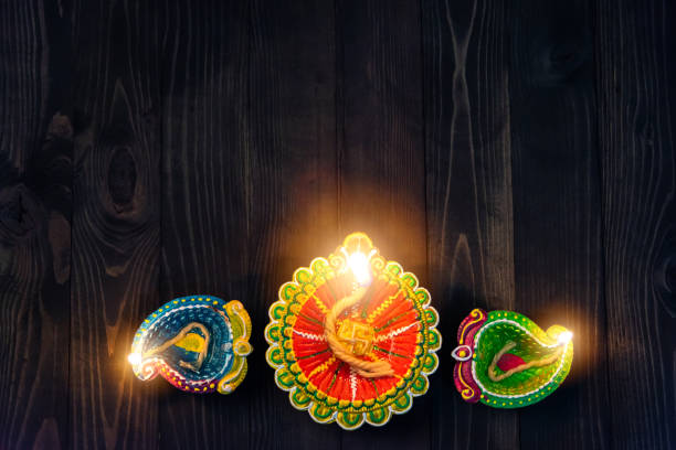 istock overhead clay lit light a fire already on Diya or oil lamp 1285412983