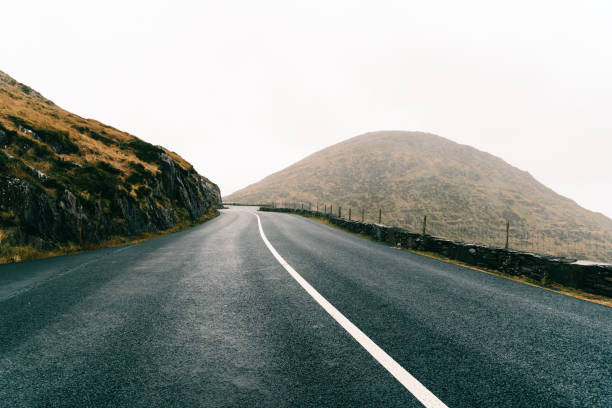 istock Misty Lonely Road in Ireland 1285415382
