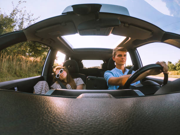 istock young happy couple in car 1285419674