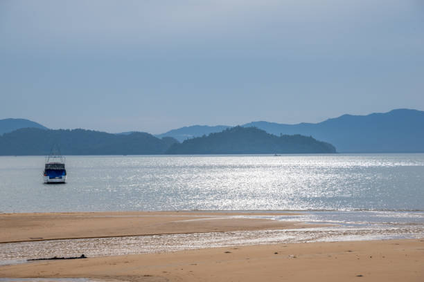 istock Beautiful view of tropical sea beach over mountains 1285419977