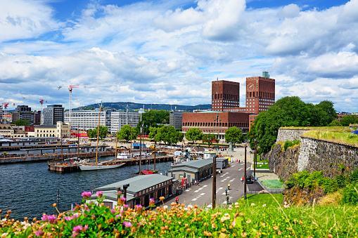 Tourists and locals around the Oslo City Hall in summer time, Norway