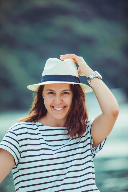 istock woman portrait in white fedora hat 1285420767