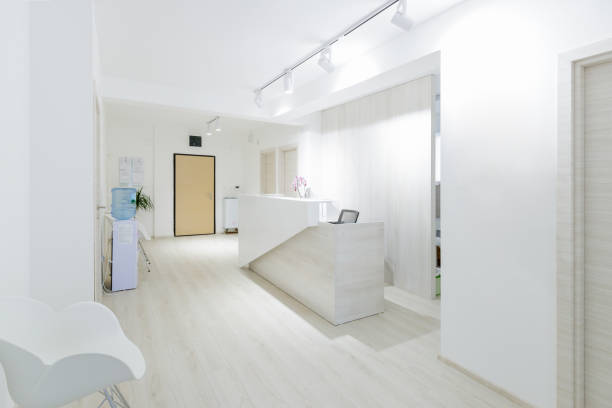 Empty waiting room and reception desk in modern clinic
