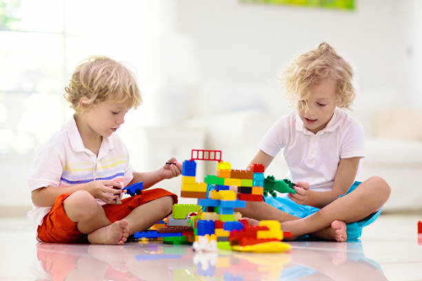 istock Child playing with toy blocks. Kids play. 1285422037