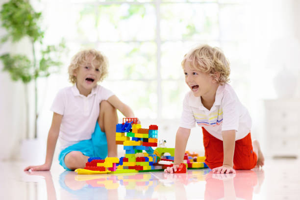 istock Child playing with toy blocks. Kids play. 1285422407