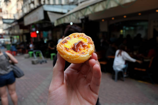 istock Hand holding Portuguese Egg tart 1285422416