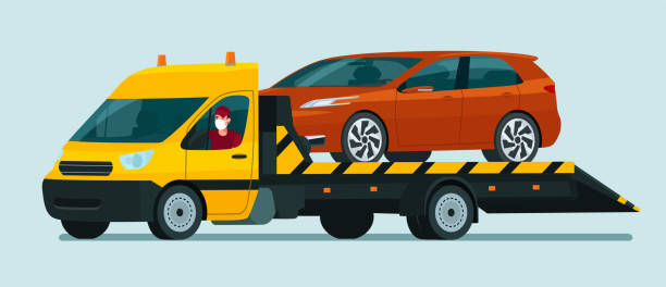 ilustrações de stock, clip art, desenhos animados e ícones de tow truck with a driver in medical mask carries a hatchback car. vector flat style illustration. - tow truck heavy truck delivering