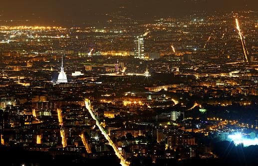 breathtaking night view of the city of Turin in Italy seen from above and the big dome of Mole Antonelliana Monument