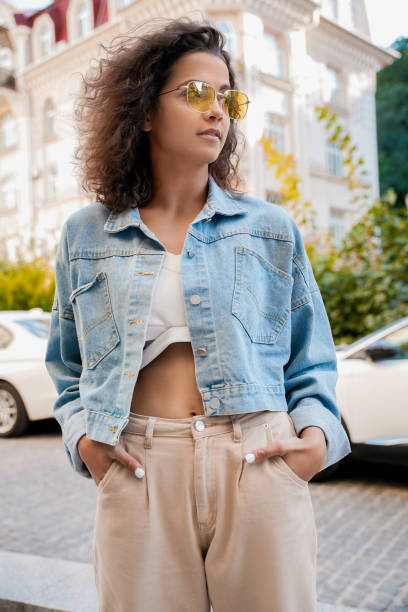 istock Stylish teen model posing on town streets after quarantine. 1285430306