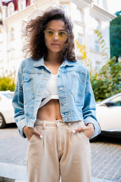 istock Stylish teen model posing on town streets after quarantine. 1285430346