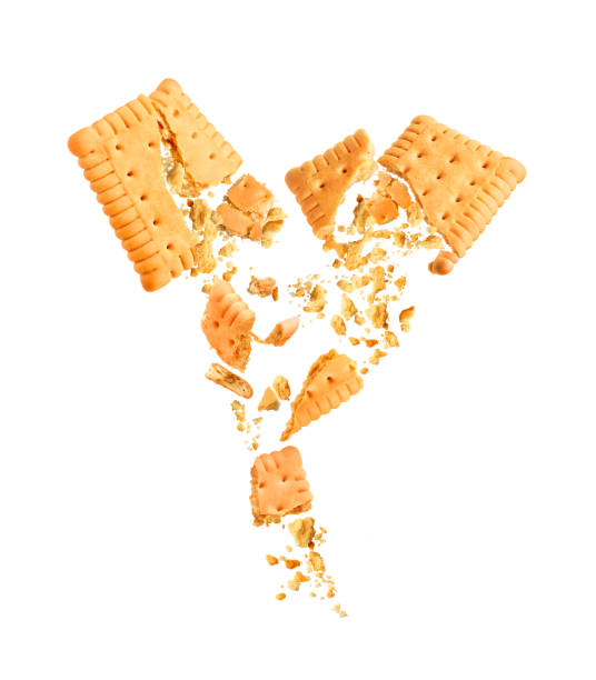 istock two broken cookies with crumbs on a white background 1285434024
