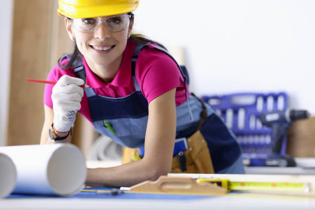 istock Woman architect makes plan for the design of an apartment 1285434340