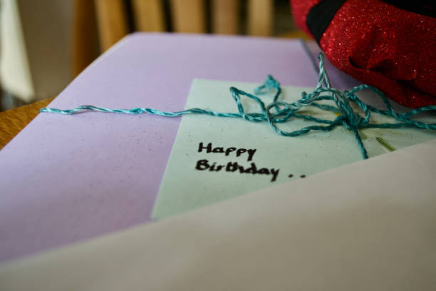 istock Handwitten 'Happy Birthday' on card envelope and present 1285434746
