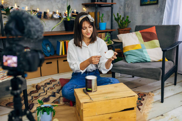 istock Carpenter woman explaining on her channel what composition of paint you need for this DIY project 1285436201