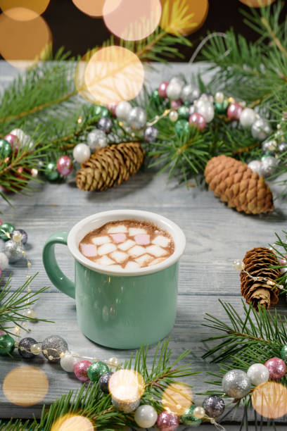 istock A mug of cocoa with marshmallows on a table with Christmas decor 1285436977