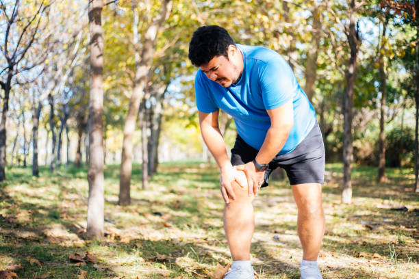istock at man suffering from knee injury 1285437698