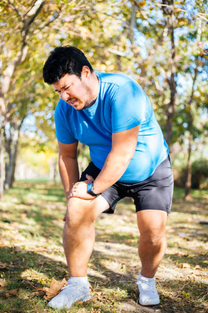 istock Unhappy man having a knee injury after workout 1285438518
