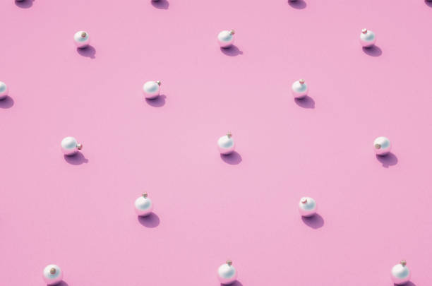 istock Silver matt Christmas balls on pink background 1285438696