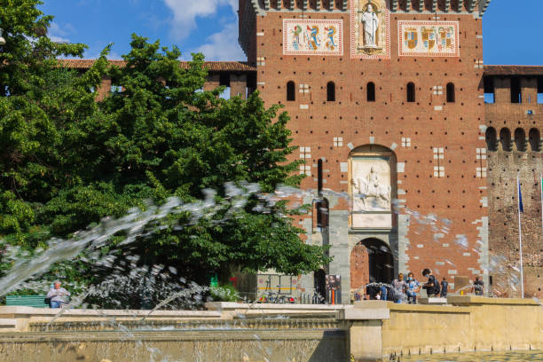 fontana di fronte al castello sforzesco, milano, italia - milan italy italy castello sforzesco color image foto e immagini stock