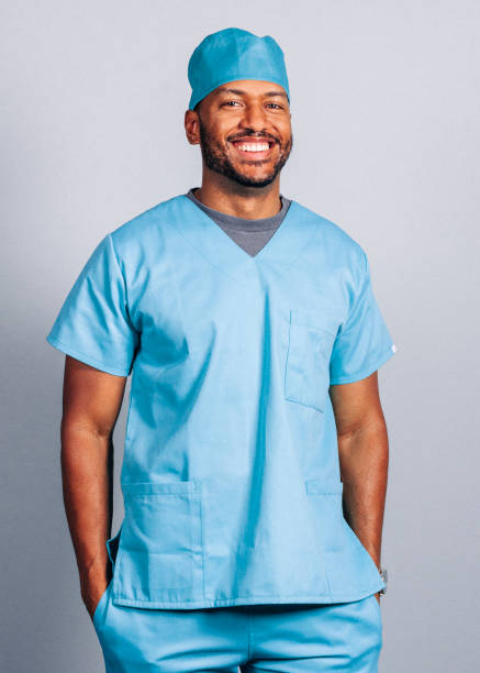 istock Smiling male surgeon with hands in pockets 1285440932