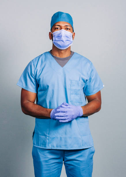 istock Male surgeon with hands clasped during COVID-19 1285441022