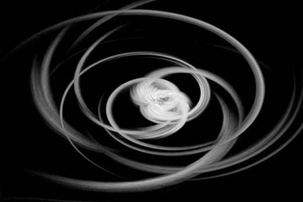 istock Abstract white digital curves on black background  - twirl effect 1285441123