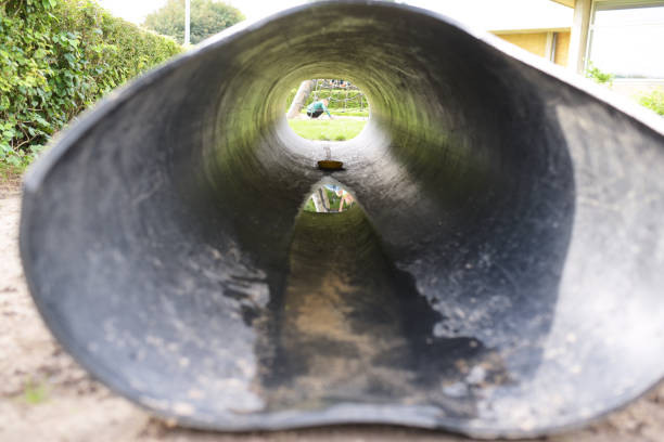 istock looking through a tunnel on a playground 1285442118