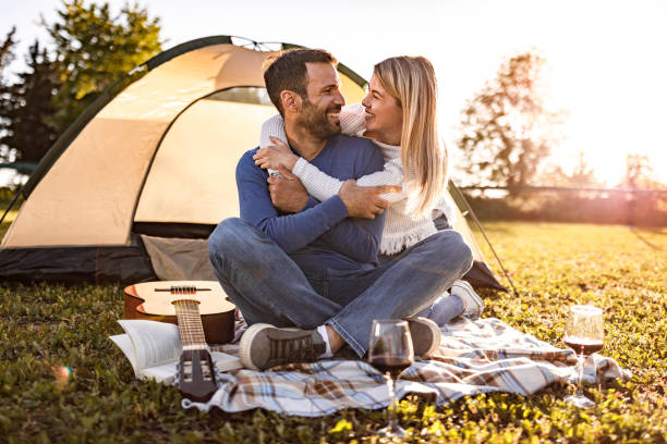 istock Embraced couple talking on a camping day in nature. 1285442420